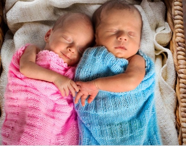 The twins being born