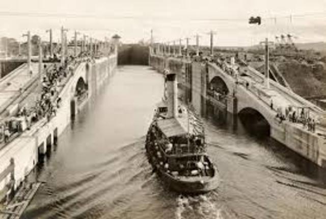The Panama Canal is completed and opened for traffic