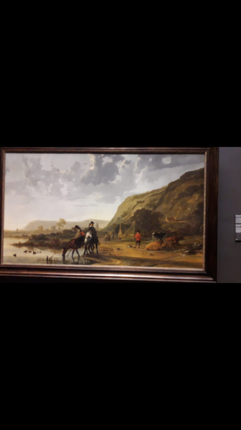 Rivierlandschap met ruiters