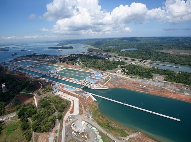 The Panama Canal is completed and opened for traffic