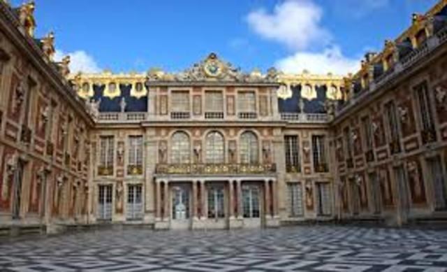 Starts renovating a hunting lodge in Versailles into a Palace.