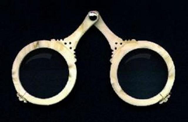 Who invented spectacles?
