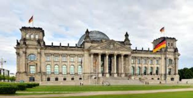 In late February, the Reichstag  is burned to the ground