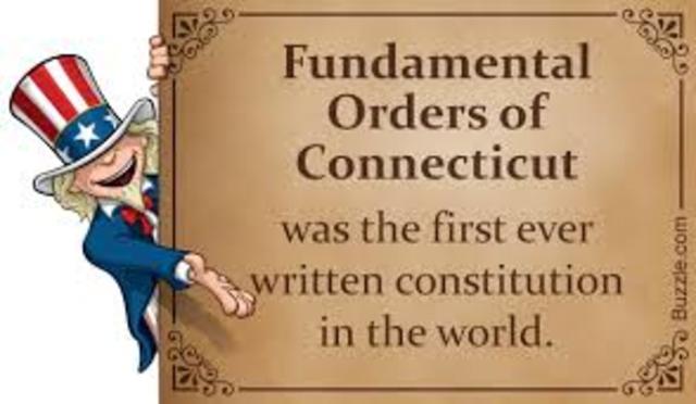 1639 Enacts first written constitution