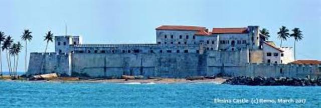 Portuguese build first slave-trade post at Elmina, Gold Coast (now Ghana)