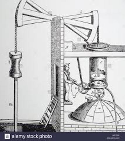Thomas Newcomen, em Staffordshire, na Grã-Bretanha, instala um motor a vapor para esgotar água em uma mina de carvão.