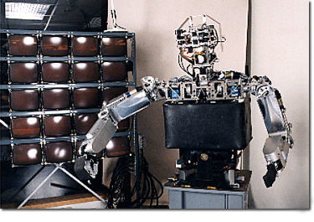 Dennett would assist in the development of a robot named "COG"