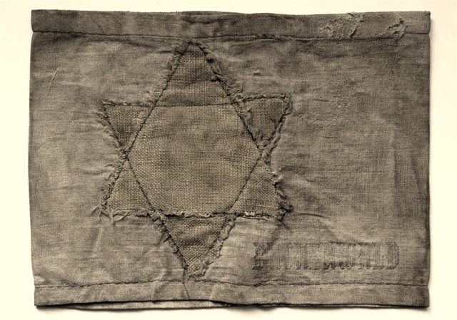 Jews in Poland must wear an armband or yellow star patch