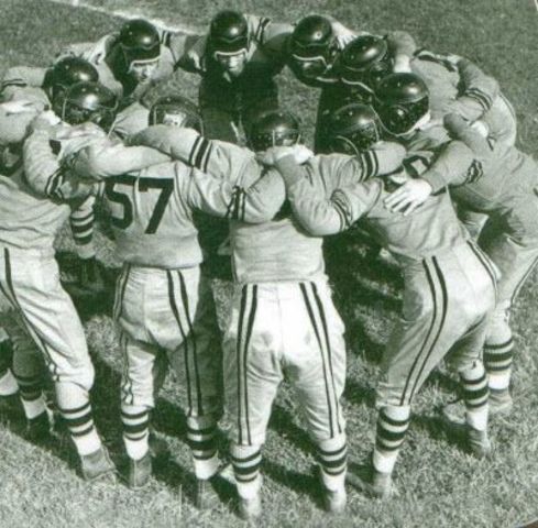 1894: Football huddle invented