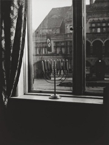 A Jewish Hanukkah menorah defies the Nazi swatiska