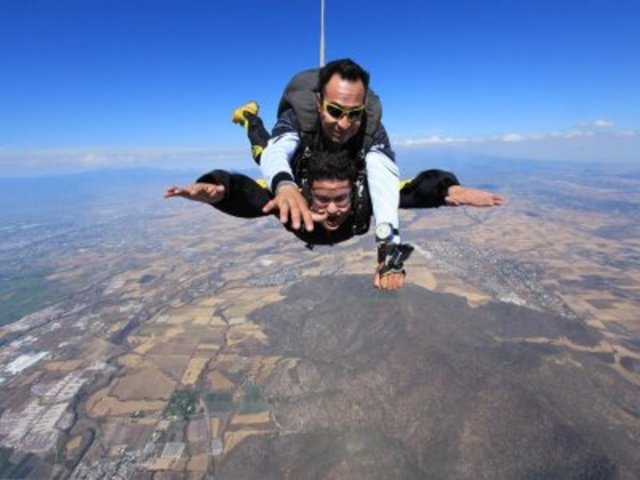 Plane jump with parachute.