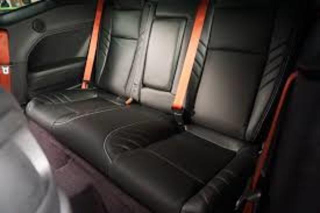 First seat belt for a motorcar