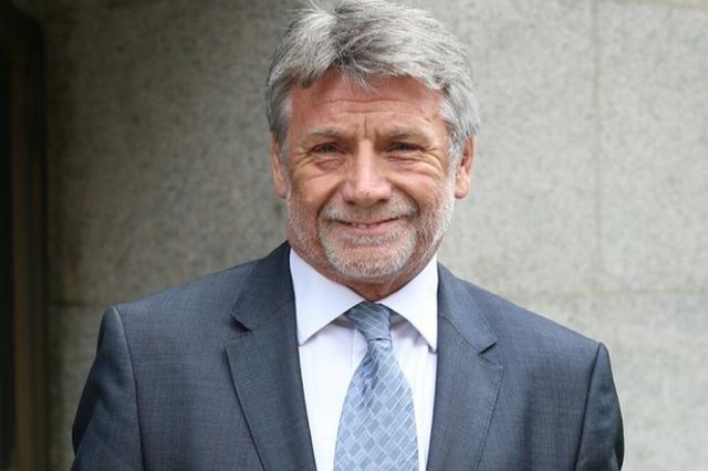 Neil Wallis, the former executive editor of the News of the World, is arrested on suspicion of conspiring to intercept communications.