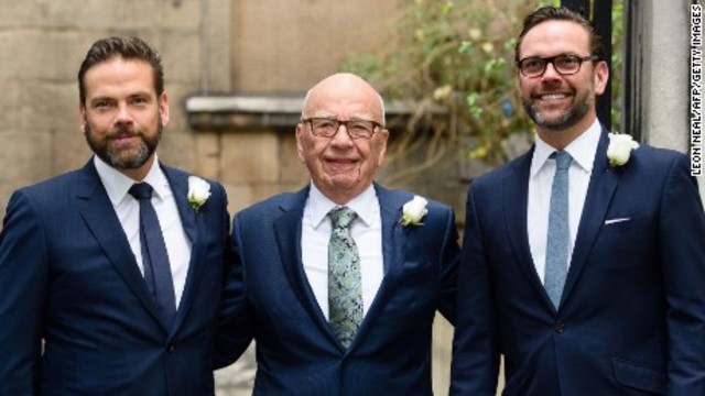 Rupert Murdoch deflects attempts by investors to remove him as chairman of News Corp at the company's annual meeting. He also retains his sons James and Lachlan as directors.