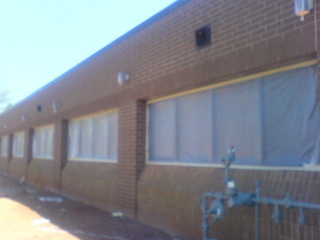 Windows masked off in preparation for painting