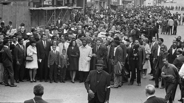 Martin Luther Kings leads a peaceful march