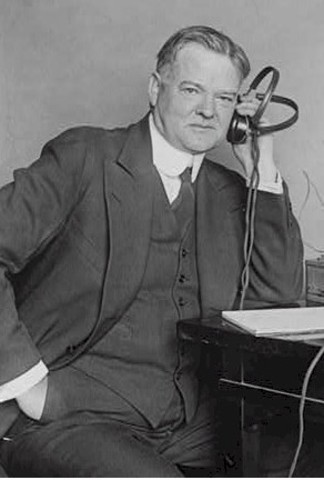 Herbert Hoover takes office
