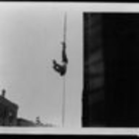 Houdini Begins Performing Upside-Down Straitjacket Escapes