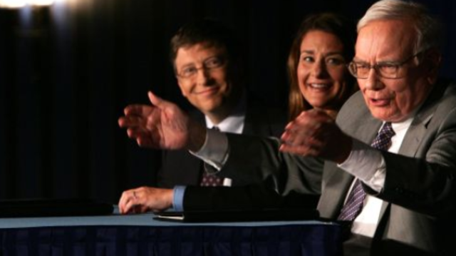 Teams with Gates Foundation to give away nearly all his wealth