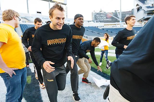 Wyatt leads the UofM Bisons in a competitive tag game against 1st graders