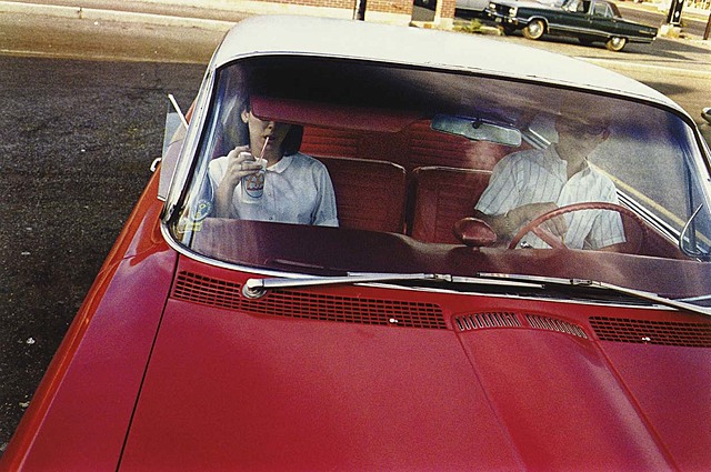 William Eggleston, Untitled (Couple in Red Car at Drive-In Restaurant, Memphis), circa 1965-68, from 'Dust Bells 2'.