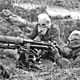 Vickers machine gun crew with gas masks