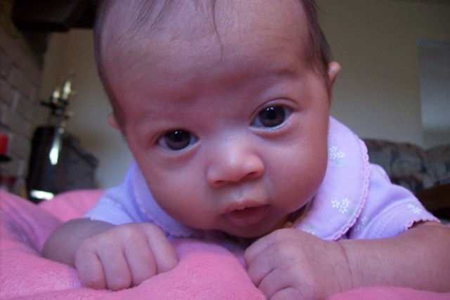 Gets the hang of holding up her head while on belly