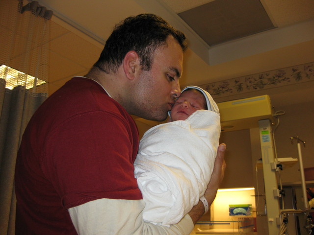 Tender kiss from dad!