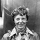 Amelia earhart standing under nose of her lockheed model 10 e electra, small