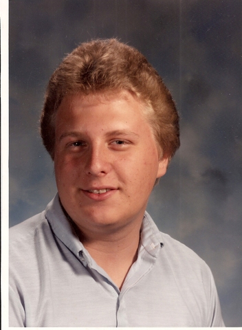 Christopher graduates from high school.