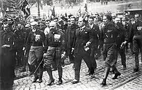 Mussolini threatens to march on Rome- political