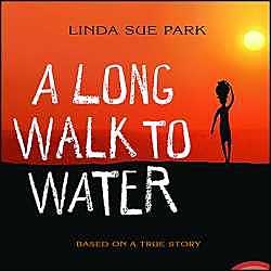 Salva sitting at school watching the teacher teach.