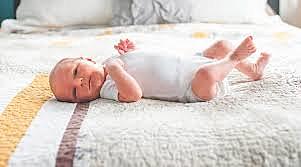 baby turning on back