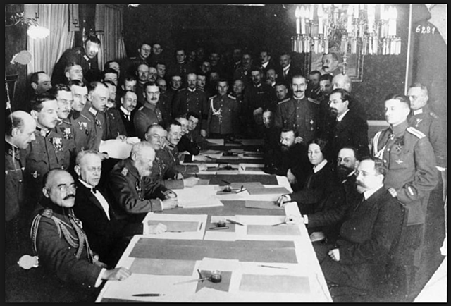 Russia signs the Treaty of Brest-Litovsk with Germany.