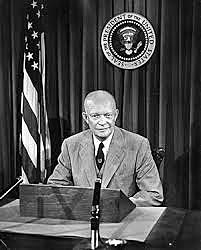 President Eisenhower declares "Domino Theory"