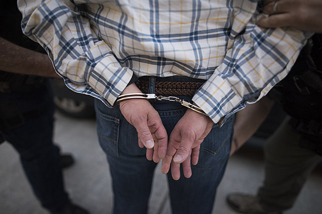 Tom Robinson arrested for raping Mayella Ewell.