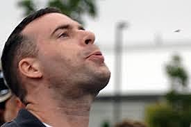 Bob Ewell spits in Atticus' face.