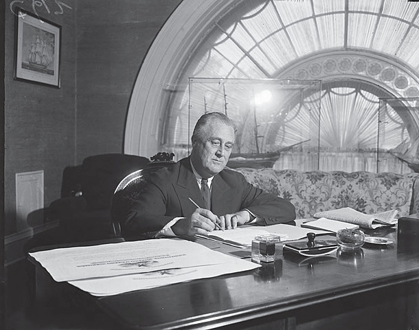 Franklin D. Roosevelt signs Executive Order 9066
