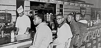 4 black college students sat at an all-white lunch counter and started a sit-in protest at a Woolworth’s store.
