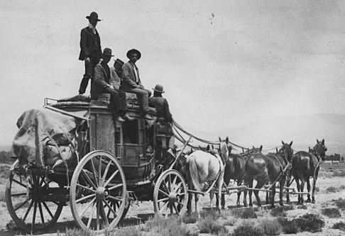 Tributes are loaded on to wagons by district