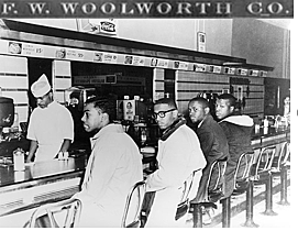 4 black college students sat at an all-white lunch counter and started a sit-in protest at a Woolworth’s store.