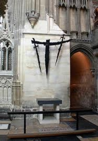 Thomas a Becket is murdered in Canterbury Cathedral