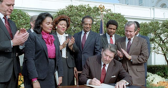 The president Ronald Reagan signed a bill to declare "Martin Luther King JR Day"