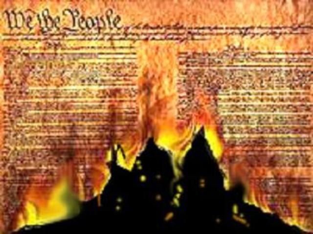 Garrison publicly burns a copy of the U.S. Constitution