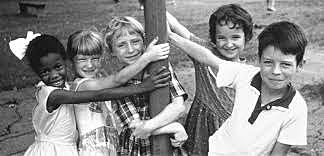 First African american child attends school with Caucasian childrem