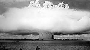 Detonation of "Bravo", a 15 megaton Hydrogen bomb on Bikini Atoll. 1,000 times more powerful than the Hiroshima and Nagasaki weapons, it vapourised three islands, displaced the islanders and caused long lasting contamination.