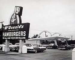 Ray Kroc opens a McDonald's fast food restaurant and, after purchasing the franchise from its original owners, oversees its national (and later, worldwide) expansion