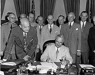 Truman signs Mutual Security Act