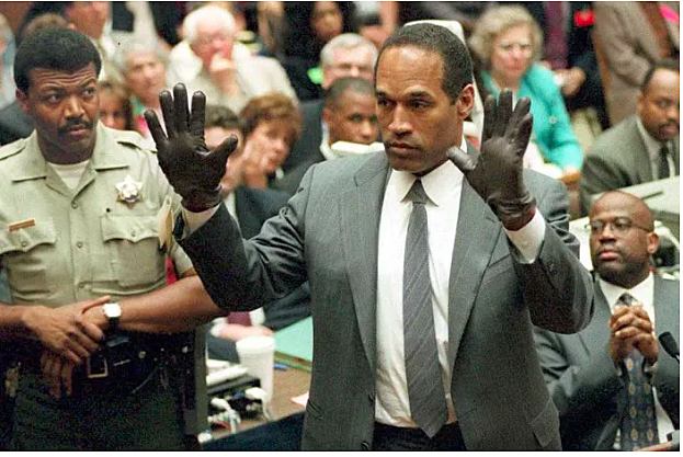 June 15 1995: O.J Simpson tries on the gloves