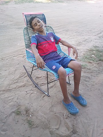 SLEEPING ON THE ARMCHAIR